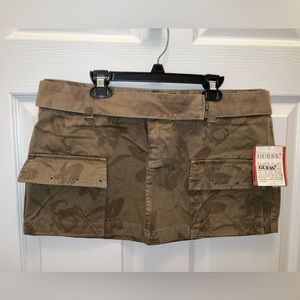 Super sexy GUESS mini skirt. NWT. Size 31. Cool hook and bar closure & belt.